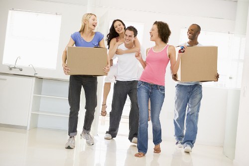 Professional team handling piano removals in Parsonsgreen with protective equipment