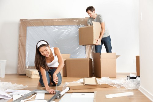 Professional movers packing household items for a Parsonsgreen home move