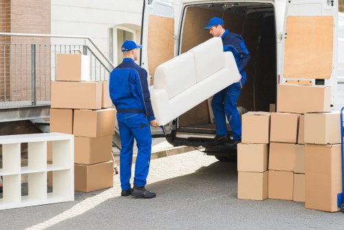 Local movers planning a furniture removal in Parsonsgreen on a residential street