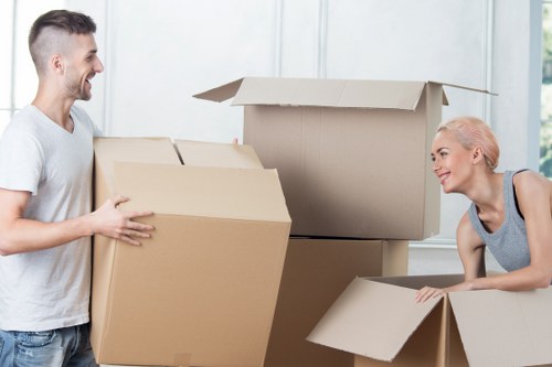 Packed office boxes and equipment ready for a commercial move in Parsons Green