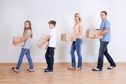 Local movers carrying furniture during a Parsonsgreen relocation